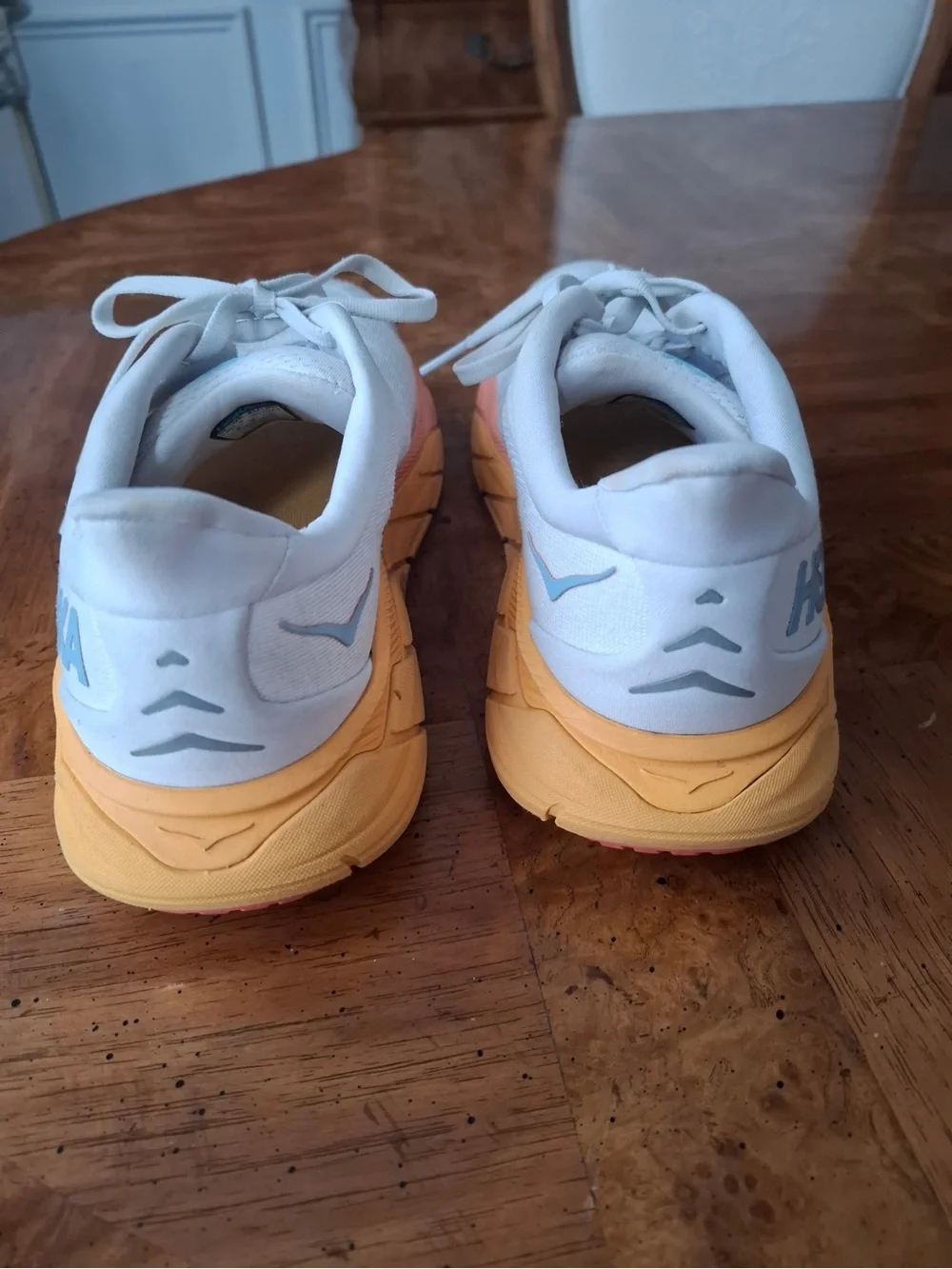 Hoka Women's White Running Shoes with Peach and Yellow Gradient Sole